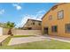 An open backyard features a brick patio area and a privacy fence at 5317 Golden Melody Ln, North Las Vegas, NV 89081