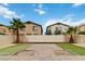 A spacious backyard features a brick patio and artificial turf, enclosed by a white privacy fence at 5317 Golden Melody Ln, North Las Vegas, NV 89081