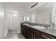 Spacious bathroom with dual sinks, granite counters and a shower/bath combo at 5317 Golden Melody Ln, North Las Vegas, NV 89081