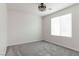 Bedroom with plush gray carpet and abundant natural light at 5317 Golden Melody Ln, North Las Vegas, NV 89081