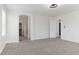 Bright main bedroom features carpet, fan, and an en-suite bathroom with walk-in closet at 5317 Golden Melody Ln, North Las Vegas, NV 89081
