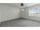 Bedroom features a large window and neutral carpet at 5317 Golden Melody Ln, North Las Vegas, NV 89081