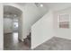 Bright entryway featuring tile flooring, a staircase, and access to a carpeted living area at 5317 Golden Melody Ln, North Las Vegas, NV 89081