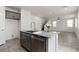 Modern kitchen island features granite countertops, a stainless steel dishwasher, and a stylish faucet at 5317 Golden Melody Ln, North Las Vegas, NV 89081