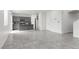 Spacious open-concept living and dining area with tile flooring and access to the kitchen at 5317 Golden Melody Ln, North Las Vegas, NV 89081