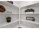 Spacious pantry with ample shelving, perfect for organizing kitchen essentials and supplies at 5317 Golden Melody Ln, North Las Vegas, NV 89081