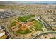 Picturesque aerial view showcasing the baseball field, playground, and well maintained surrounding community at 5594 Trilling Bird Dr, Las Vegas, NV 89135