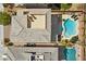 Aerial view showcasing a backyard oasis complete with a pool, spa, and lush landscaping at 5594 Trilling Bird Dr, Las Vegas, NV 89135