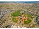 Wide aerial shot of community baseball fields, park, and neighborhood, set against mountain backdrop at 5594 Trilling Bird Dr, Las Vegas, NV 89135