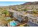 View of the property with pool and landscaping with mountain views at 5594 Trilling Bird Dr, Las Vegas, NV 89135