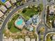 Community pool and park with lounge seating, green spaces and shade canopies, accessible from roundabout at 5594 Trilling Bird Dr, Las Vegas, NV 89135