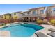 Beautiful backyard showcasing a sparkling pool and spa, offering a serene oasis at 5594 Trilling Bird Dr, Las Vegas, NV 89135