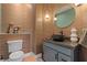Charming powder room with unique patterned wallpaper, dark vessel sink, and modern lighting fixture at 5594 Trilling Bird Dr, Las Vegas, NV 89135