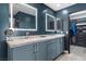 Elegant bathroom with double sinks, illuminated mirrors, and a walk-in closet at 5594 Trilling Bird Dr, Las Vegas, NV 89135