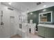 Bathroom featuring an all-glass shower, vanity, and marble countertops at 5594 Trilling Bird Dr, Las Vegas, NV 89135