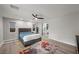 Bright bedroom featuring a ceiling fan, cozy bed, and a colorful rug at 5594 Trilling Bird Dr, Las Vegas, NV 89135