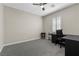 Versatile bedroom with neutral walls, large window and a dedicated desk area perfect for work or study at 5594 Trilling Bird Dr, Las Vegas, NV 89135
