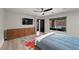 Comfortable bedroom with a built-in dresser and a view of the backyard pool area at 5594 Trilling Bird Dr, Las Vegas, NV 89135