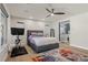 Stylish bedroom with a comfortable bed, a view of the ensuite bathroom, and modern decor at 5594 Trilling Bird Dr, Las Vegas, NV 89135
