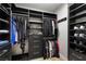 Spacious walk-in closet with custom shelving and ample storage for clothes and shoes at 5594 Trilling Bird Dr, Las Vegas, NV 89135