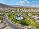 Aerial view of the community pool area and surrounding neighborhood at 5594 Trilling Bird Dr, Las Vegas, NV 89135
