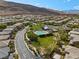 Aerial view of the community pool area surrounded by trees at 5594 Trilling Bird Dr, Las Vegas, NV 89135