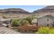 Rooftop view of neighboring homes in a suburban neighborhood with mountains in the background at 5594 Trilling Bird Dr, Las Vegas, NV 89135
