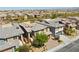 Two-story home with a well-maintained lawn and a three car garage at 5594 Trilling Bird Dr, Las Vegas, NV 89135