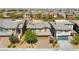 Two-story home featuring a well-manicured lawn and a three car garage at 5594 Trilling Bird Dr, Las Vegas, NV 89135