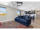 Bright and open living space with a modern kitchen and comfortable seating, creating a welcoming atmosphere at 5594 Trilling Bird Dr, Las Vegas, NV 89135