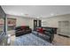 Spacious living area featuring stylish leather sofas and a patterned rug at 5594 Trilling Bird Dr, Las Vegas, NV 89135