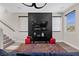 Cozy living room with a modern TV console, plush seating, and a stylish geometric area rug at 5594 Trilling Bird Dr, Las Vegas, NV 89135