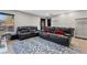 Living room with plush seating, modern decor, and a large window at 5594 Trilling Bird Dr, Las Vegas, NV 89135
