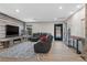Comfortable living room features a fireplace, television, and cozy seating, ideal for relaxation at 5594 Trilling Bird Dr, Las Vegas, NV 89135