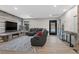 Modern living room with luxury seating, decor, and a sleek fireplace at 5594 Trilling Bird Dr, Las Vegas, NV 89135