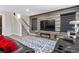 Cozy living room featuring a modern fireplace and large TV, providing a stylish relaxation space at 5594 Trilling Bird Dr, Las Vegas, NV 89135