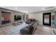 Modern living room with an entertainment center and view of the backyard pool at 5594 Trilling Bird Dr, Las Vegas, NV 89135