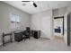 Home office with neutral walls, plush patterned carpet and large window at 5594 Trilling Bird Dr, Las Vegas, NV 89135