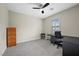 A well-lit home office with stylish carpet and desk space at 5594 Trilling Bird Dr, Las Vegas, NV 89135