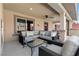 Covered patio features comfortable seating and a ceiling fan, perfect for outdoor relaxation at 5594 Trilling Bird Dr, Las Vegas, NV 89135