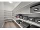 Organized walk-in pantry with ample shelving and stylish storage boxes for efficient kitchen storage at 5594 Trilling Bird Dr, Las Vegas, NV 89135