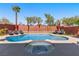Backyard pool and hot tub with lounge chairs and landscaping for outdoor enjoyment at 5594 Trilling Bird Dr, Las Vegas, NV 89135