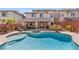 Backyard pool with hot tub and outdoor kitchen, perfect for entertaining guests at 5594 Trilling Bird Dr, Las Vegas, NV 89135