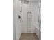 Modern shower with decorative tile, rainfall shower head, and built-in bench at 5594 Trilling Bird Dr, Las Vegas, NV 89135