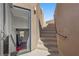 Exterior shot of stairway with a doorway leading to a lower level at 5594 Trilling Bird Dr, Las Vegas, NV 89135