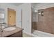 Bathroom sink with granite countertop and tiled walk in shower at 6236 Mount Palomar Ave, Las Vegas, NV 89139
