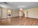 Spacious bedroom with wood-look floors and doors leading to a bathroom and hallway at 6236 Mount Palomar Ave, Las Vegas, NV 89139