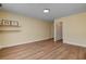 Bedroom with wood-look floors, neutral paint, and open closet at 6236 Mount Palomar Ave, Las Vegas, NV 89139