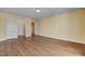 Bedroom with wood-look floors, neutral paint, and closet doors at 6236 Mount Palomar Ave, Las Vegas, NV 89139