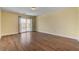 Bedroom with wood-look floors and balcony with sliding doors at 6236 Mount Palomar Ave, Las Vegas, NV 89139